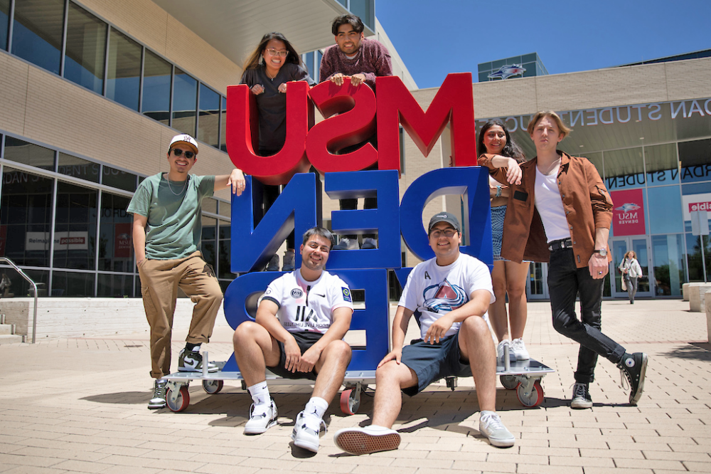 students-posing-MSU-Denver-sign-JSSB